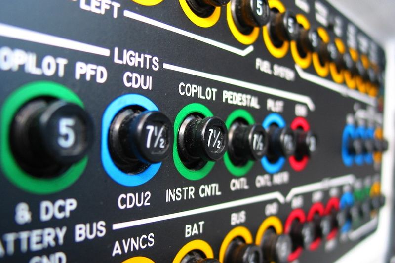 Colourful circuit breaker panel with labeled breakers